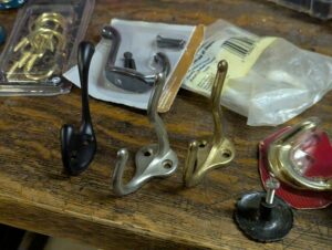 an assortment of wall hooks and drawer knobs