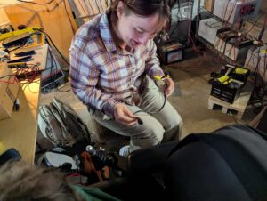 a person rewiring some  wheelchair controller equipment