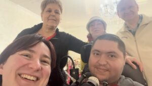four people smiling for a selfie