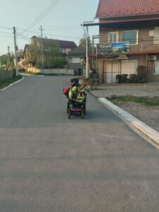 Driving my power wheelchair through the neighborhood during an evening walk