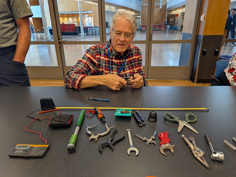 ralf hotchkiss with a small bag of tools carefully laid out on a table