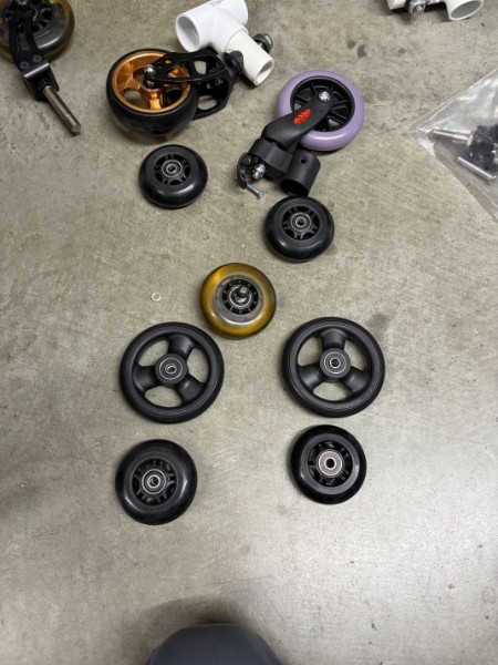 an assortment of several different small caster wheels, all slightly different sizes